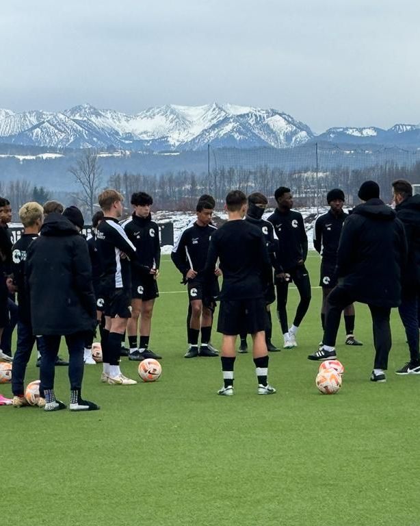 A squad training with the Alps behind, Germany