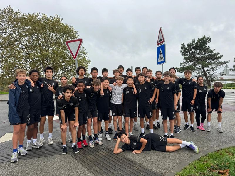 A squad photo on a quiet street