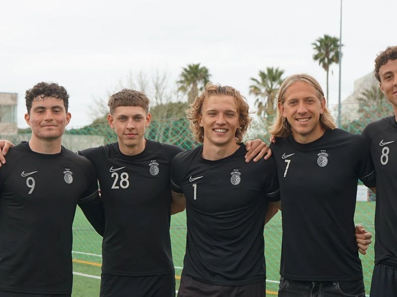 Five teammates together after training