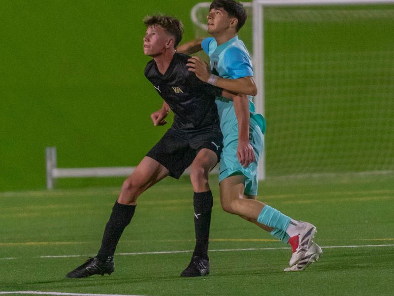 Two players competing for the ball